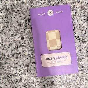 Casely iPhone 14 plus case. Tan-and-white checkered. New in box.